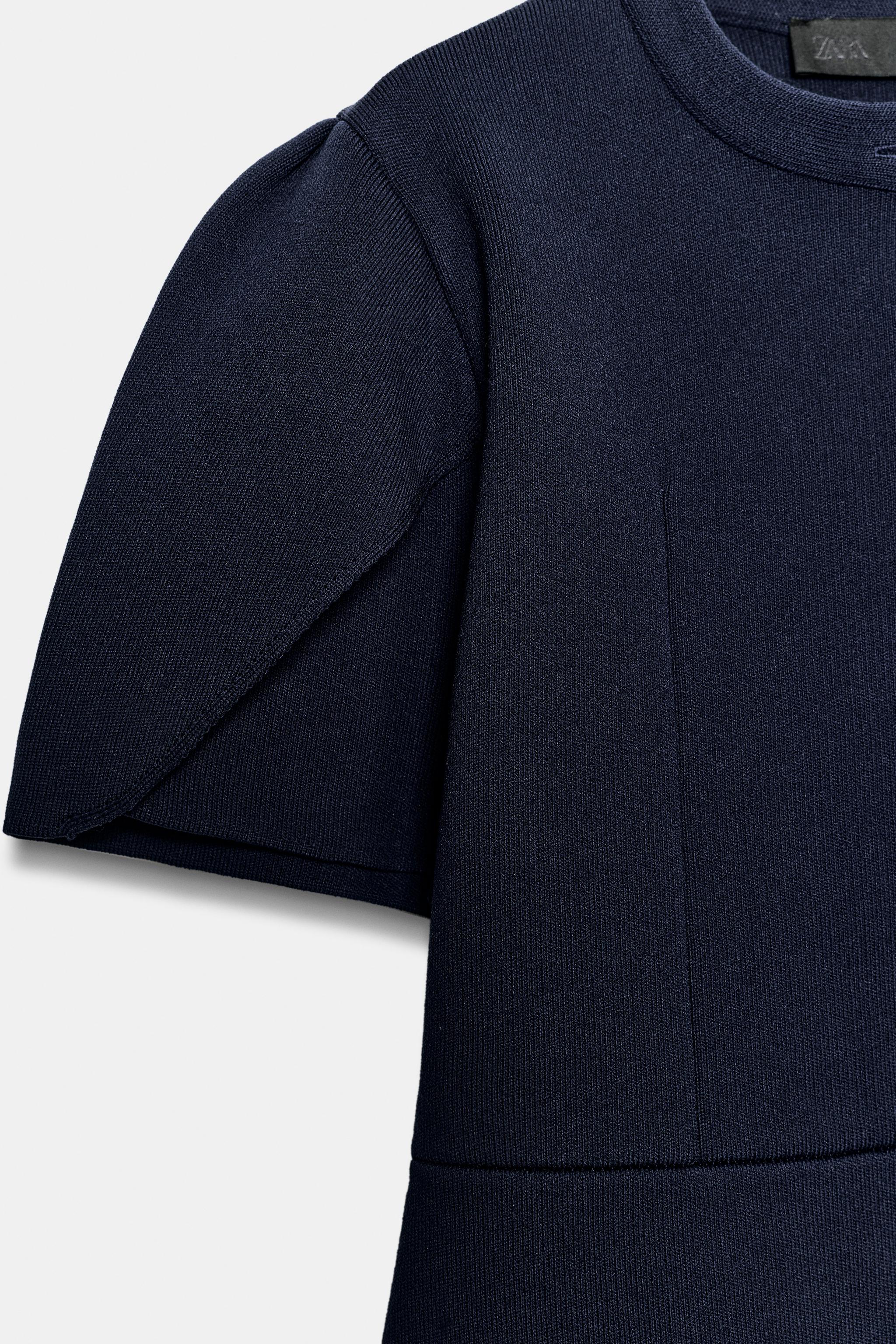 GILET EN MAILLE À MANCHES BOUFFANTES ET OUVERTURES